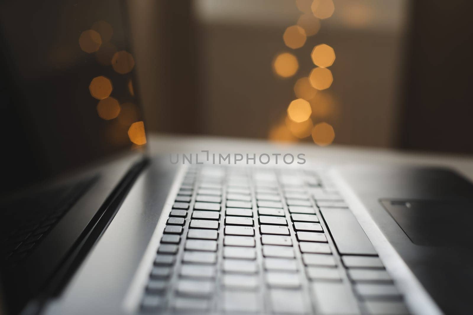 Freelance, working at home office, keyboard close up. Close up of laptop keyboard with blank screen