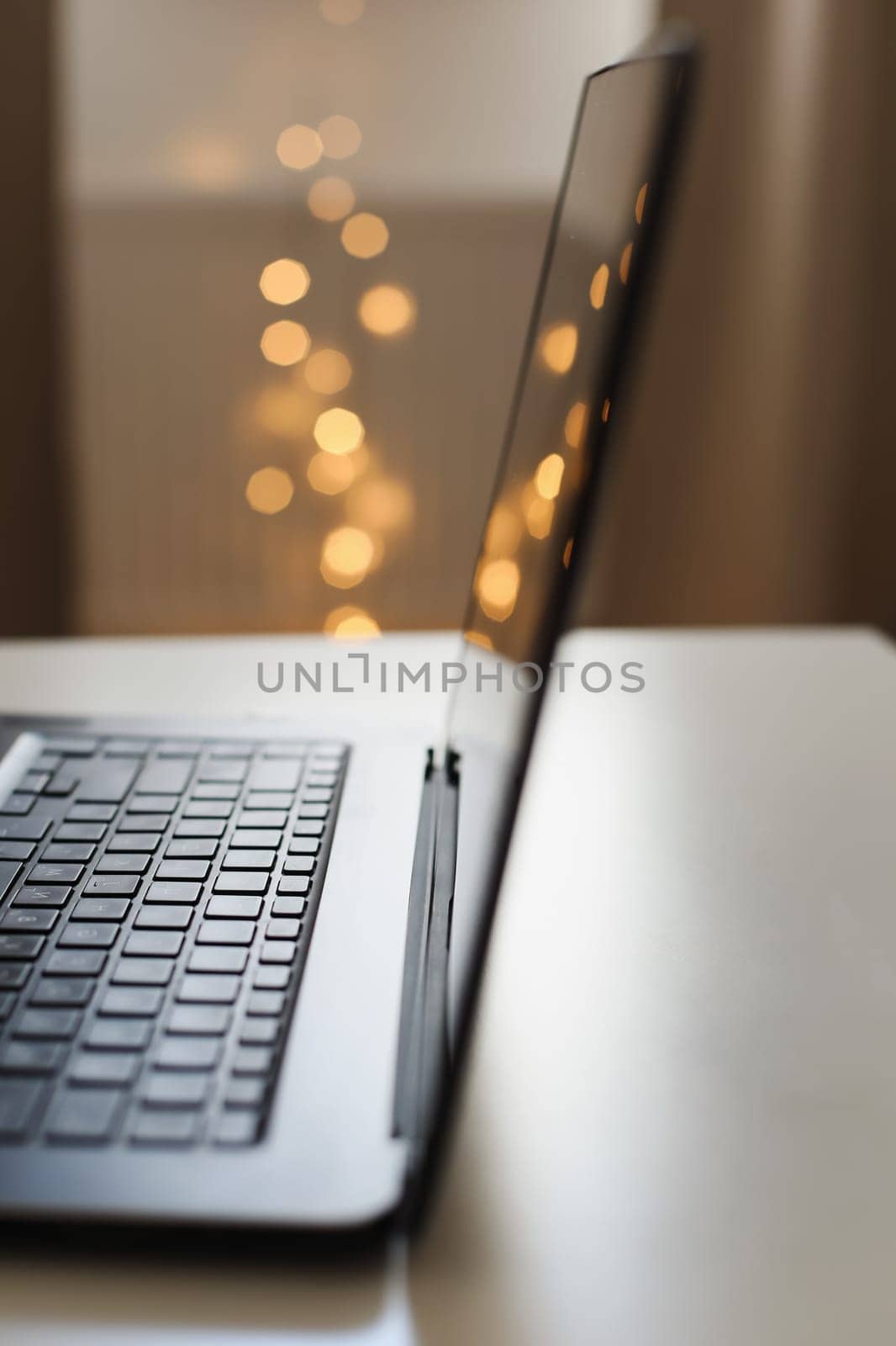 Freelance, working at home office, keyboard close up. Close up of laptop keyboard with blank screen