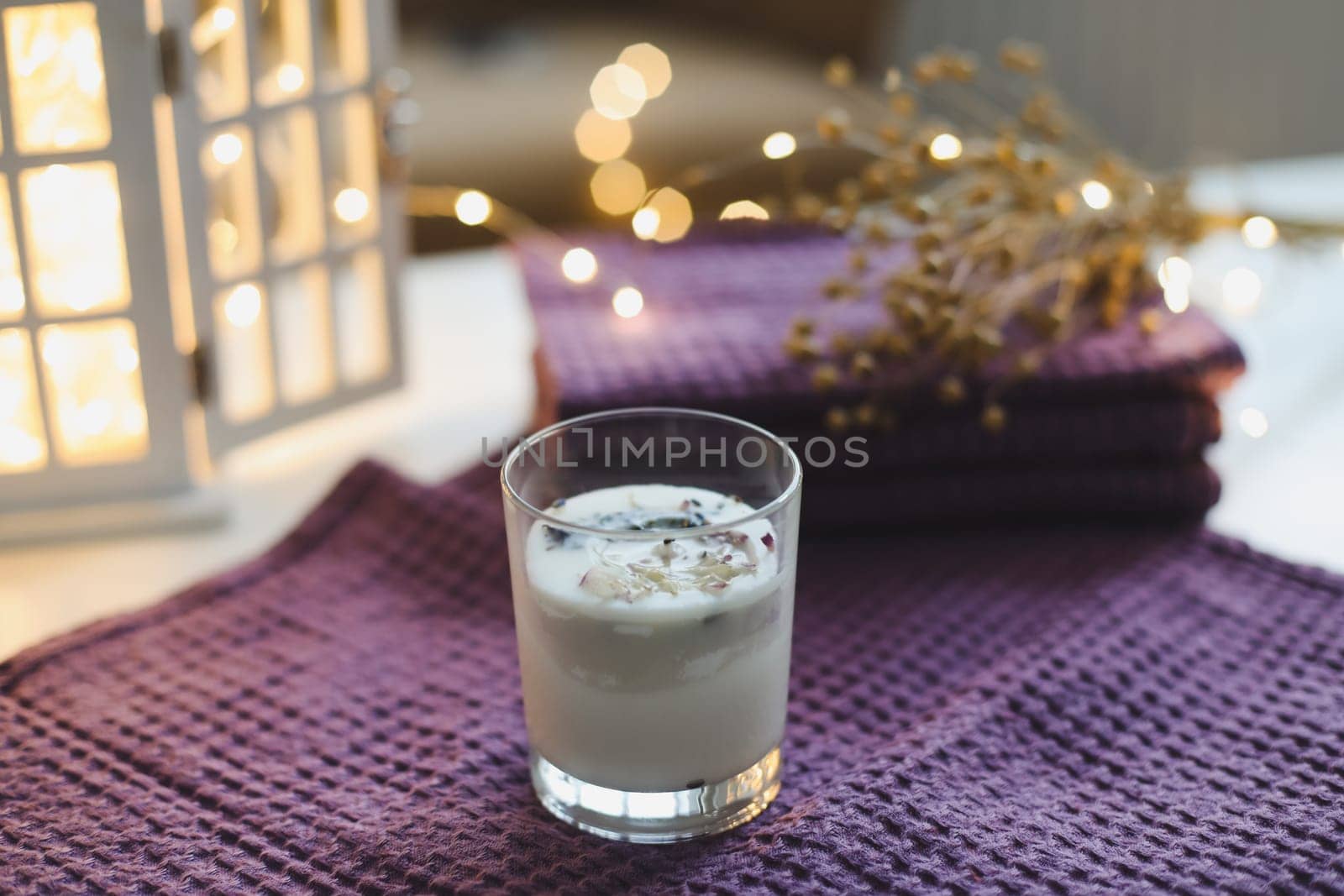 burning candles on table. Interior decor. cozy comfortable home autumn still life with a candle, textile and decorations.