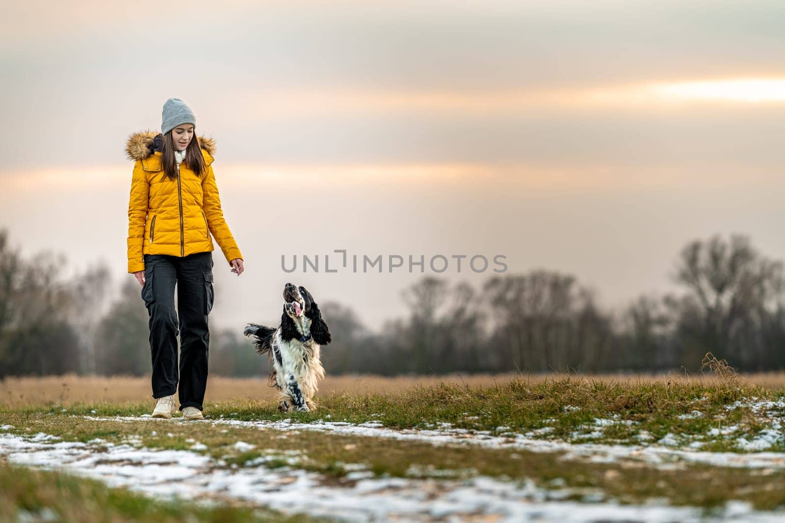 teenager with a dog on a walk in the nature. High quality photo