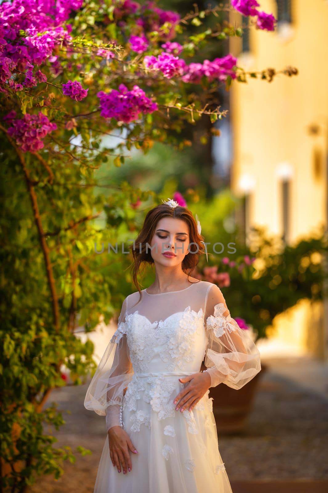 Stylish young bride on her wedding day in Italy.elegant Bride from Tuscany.Bride in a white wedding dress.