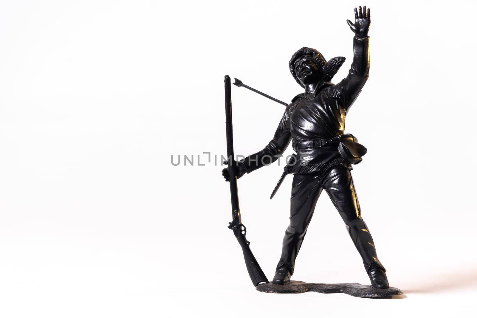 Vintage toy black soldier isolated on white background.