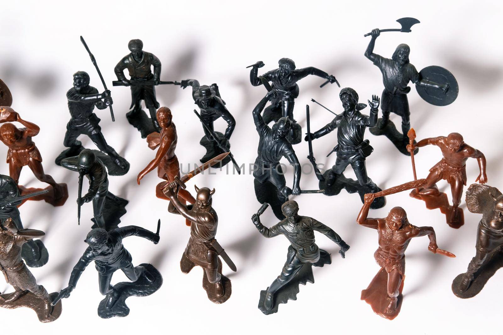 A set of different toy figures of soldiers on a white background.