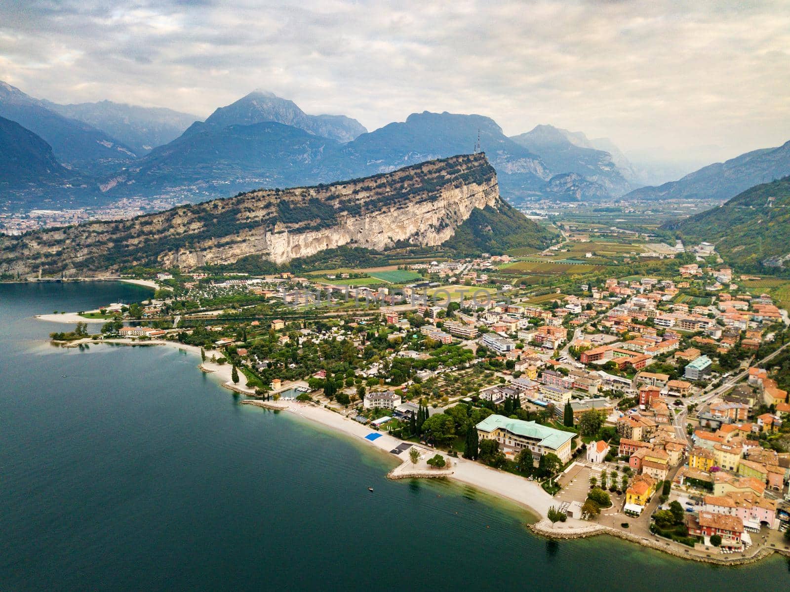 Top view of Lake Lago di Garda and the village of Torbole, alpine scenery. Italy.