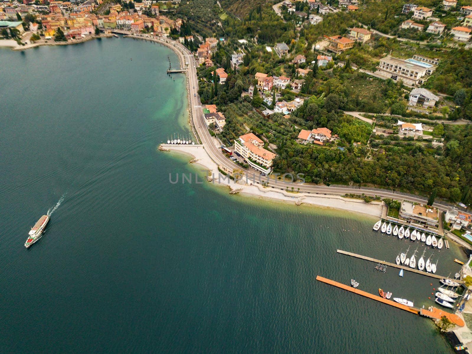 Top view of Lake Lago di Garda and the village of Torbole, alpine scenery. Italy.
