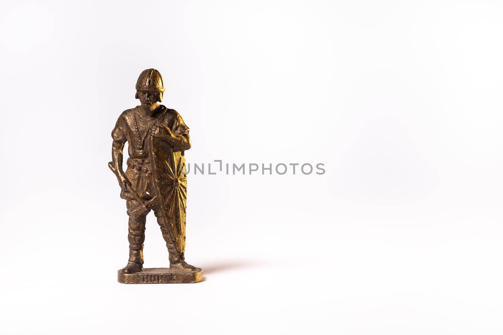 Vintage toy brown soldier knight isolated on white background.