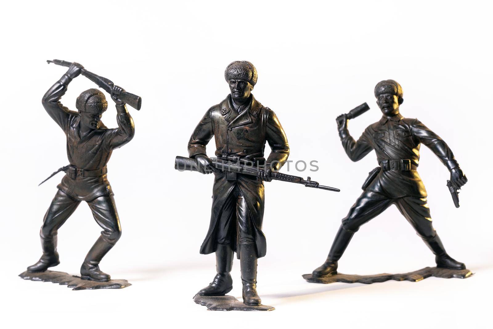 Vintage toy black soldiers isolated on white background.