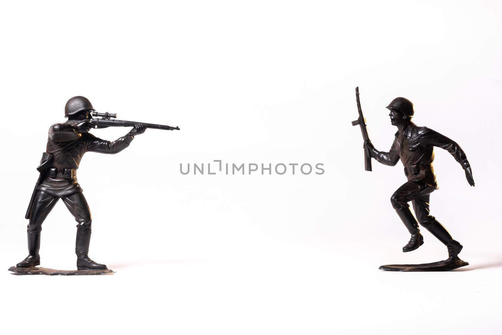 Vintage toy black soldiers isolated on white background.