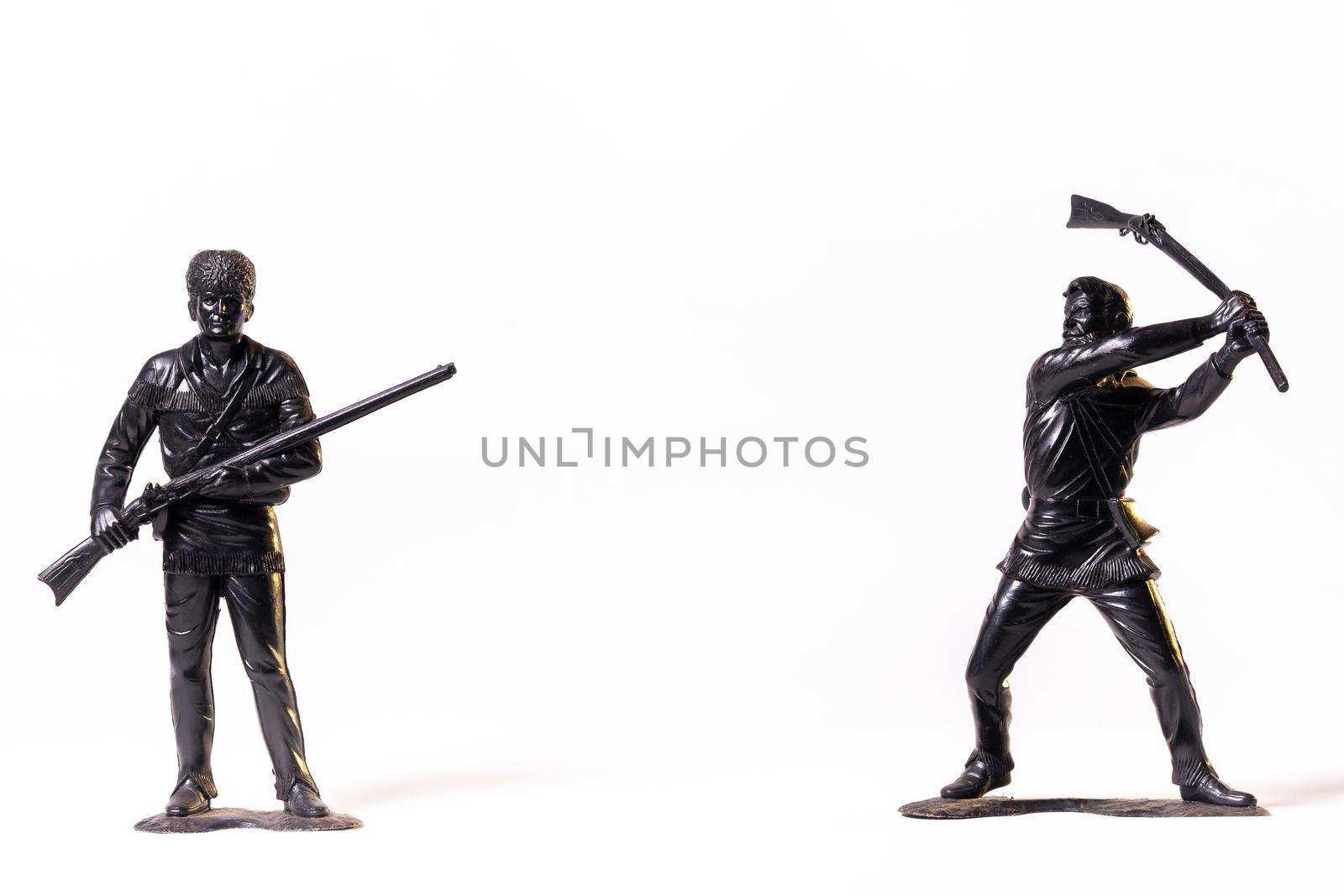 Vintage toy black soldiers isolated on white background.