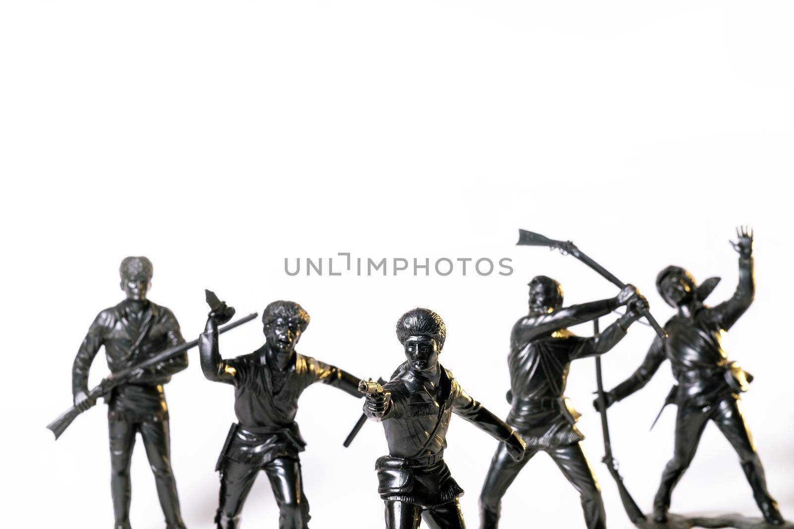 Vintage toy black soldiers isolated on white background.