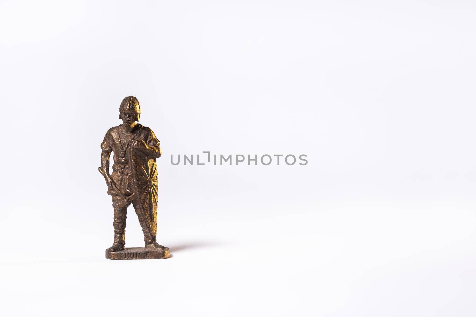 Vintage toy brown soldier knight isolated on white background.