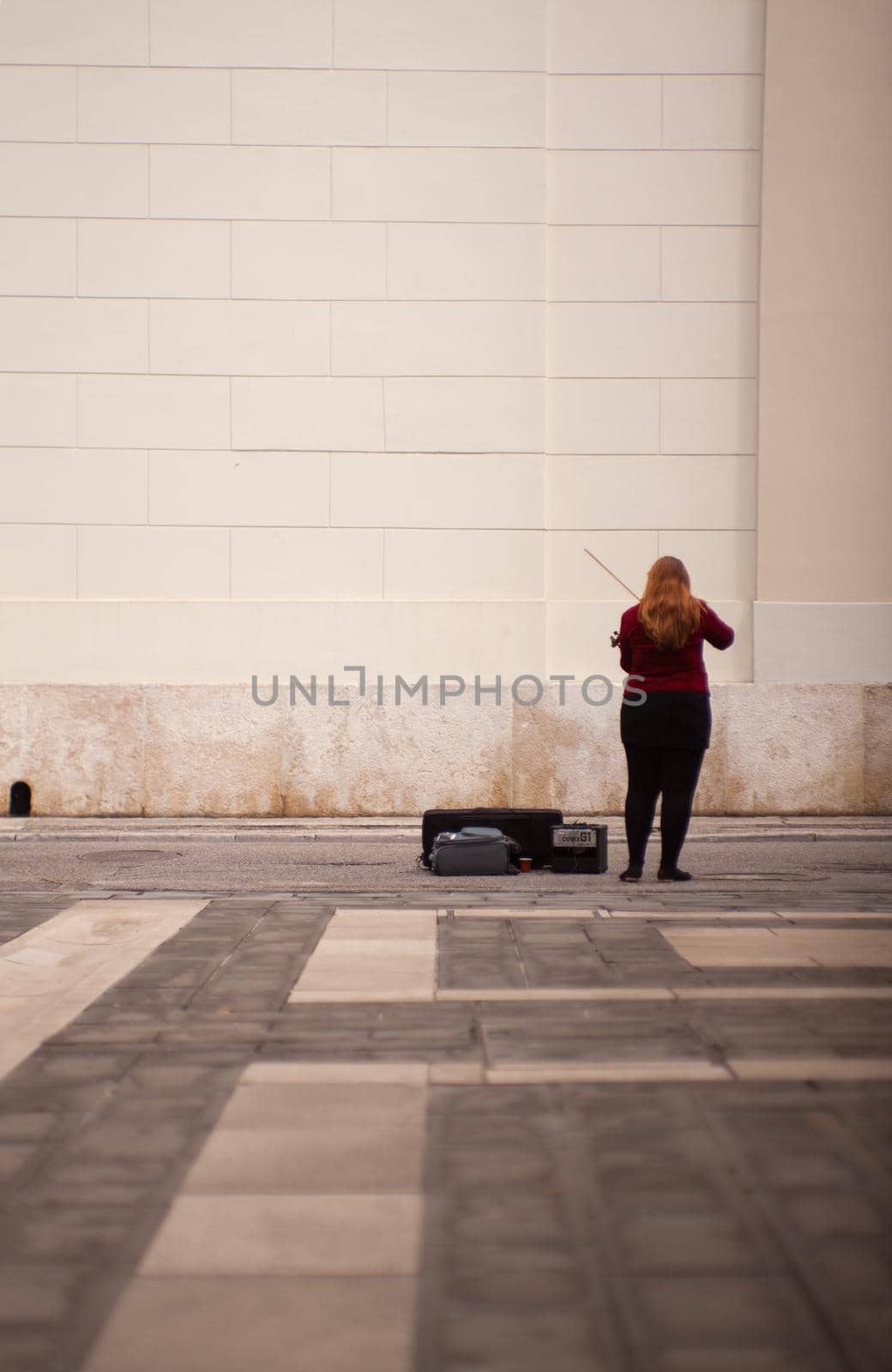 TRIESTE, ITALY - MAY, 14: Female violinist playing in the street on May 14, 2016