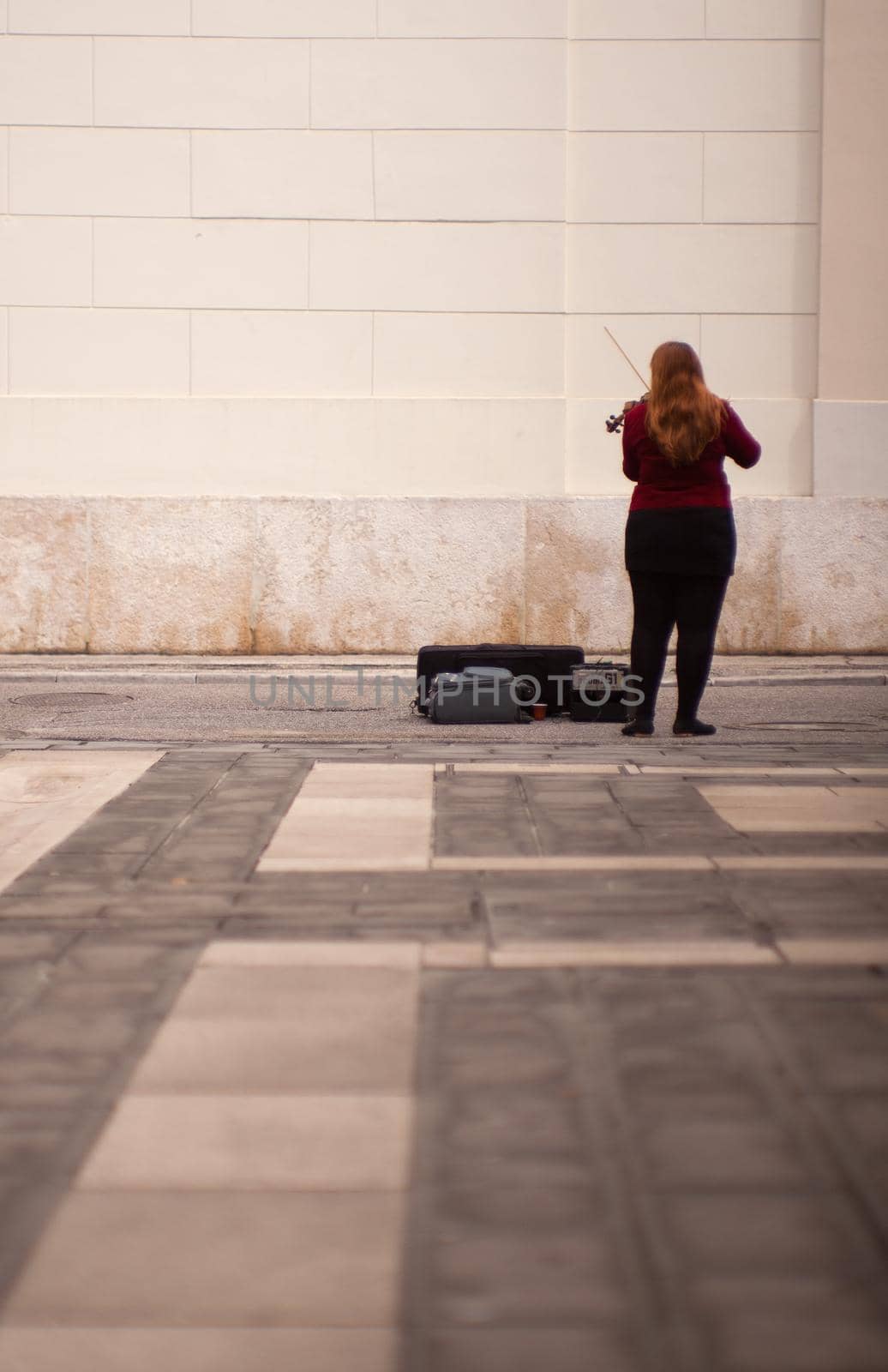 TRIESTE, ITALY - MAY, 14: Female violinist playing in the street on May 14, 2016