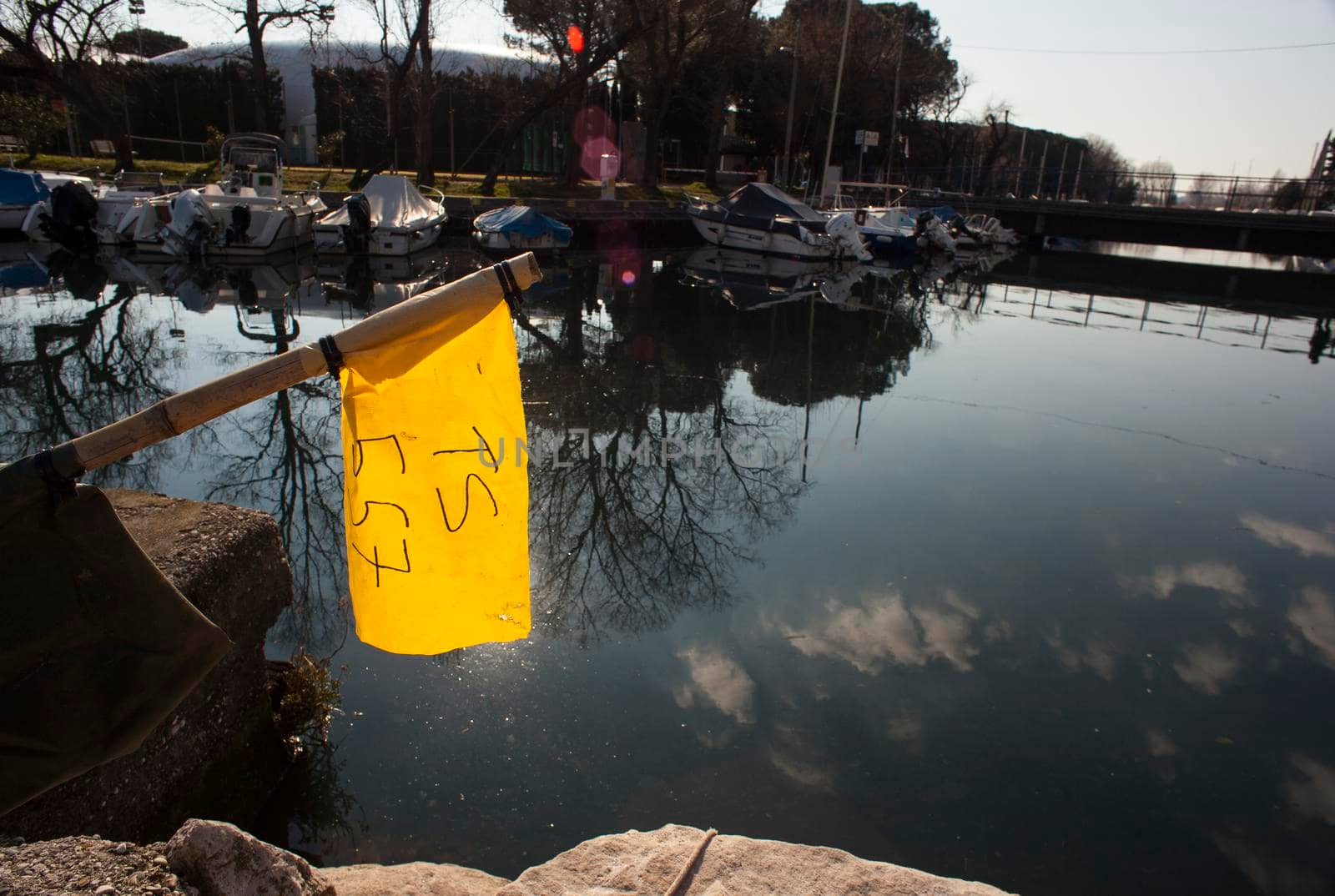 Yellow flag of a boat by bepsimage