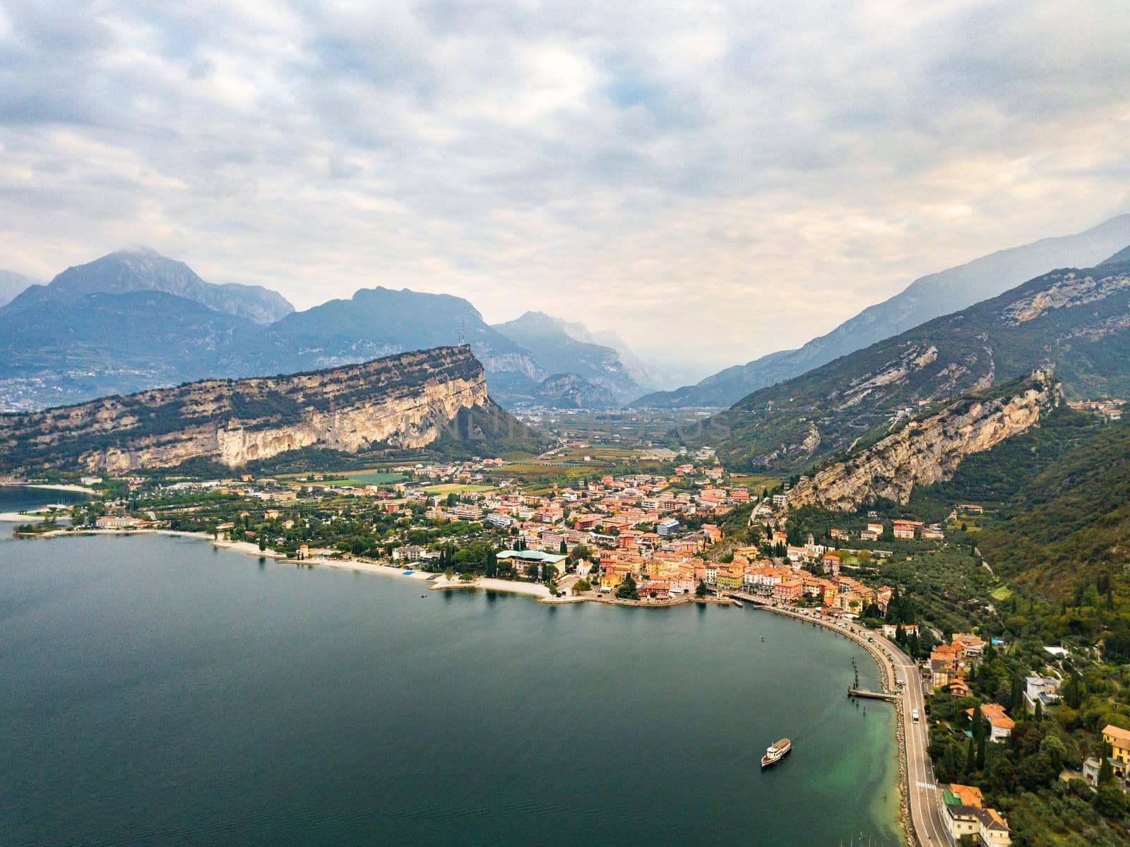 Top view of Lake Lago di Garda and the village of Torbole, alpine scenery. Italy.