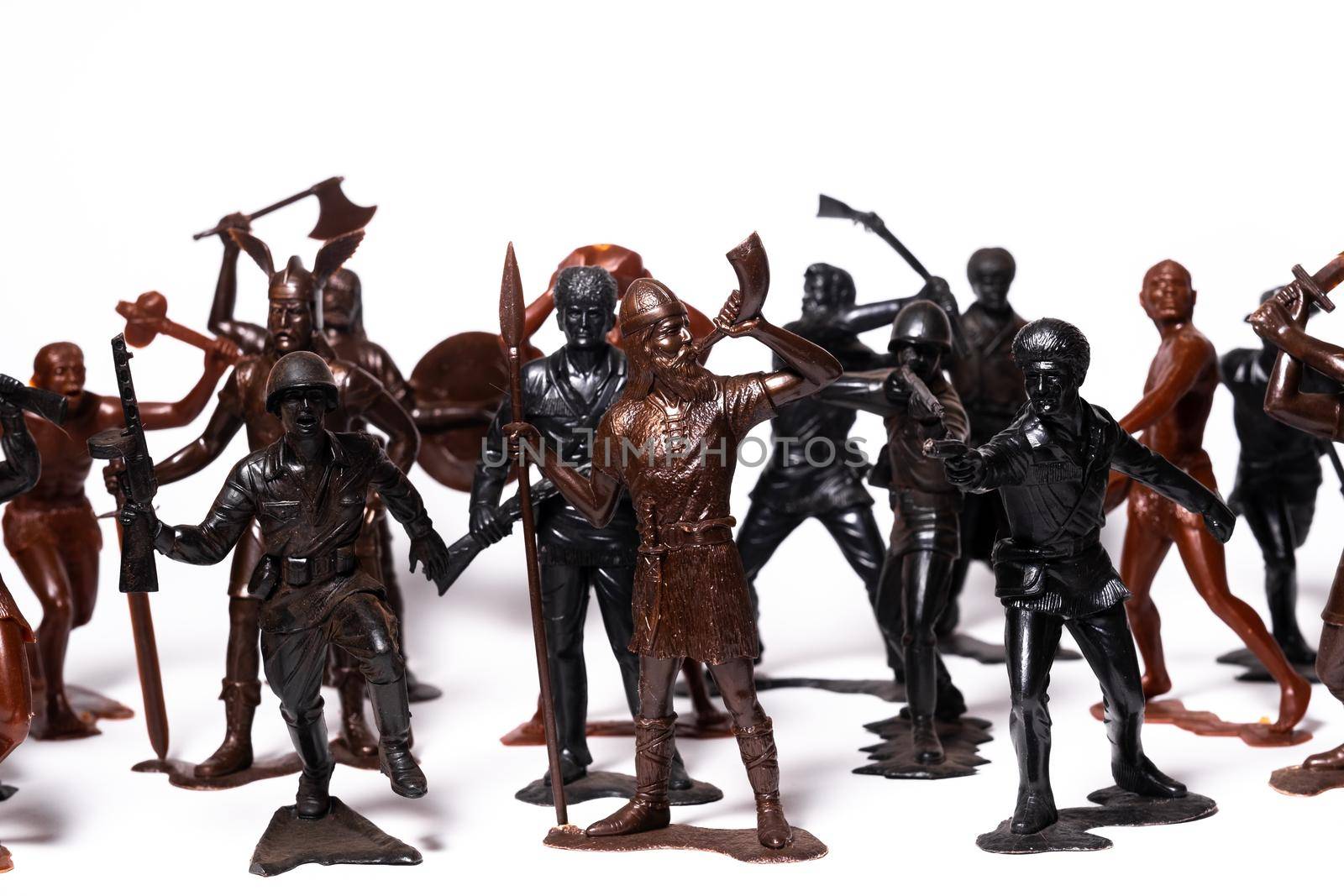 A set of different toy figures of soldiers on a white background.