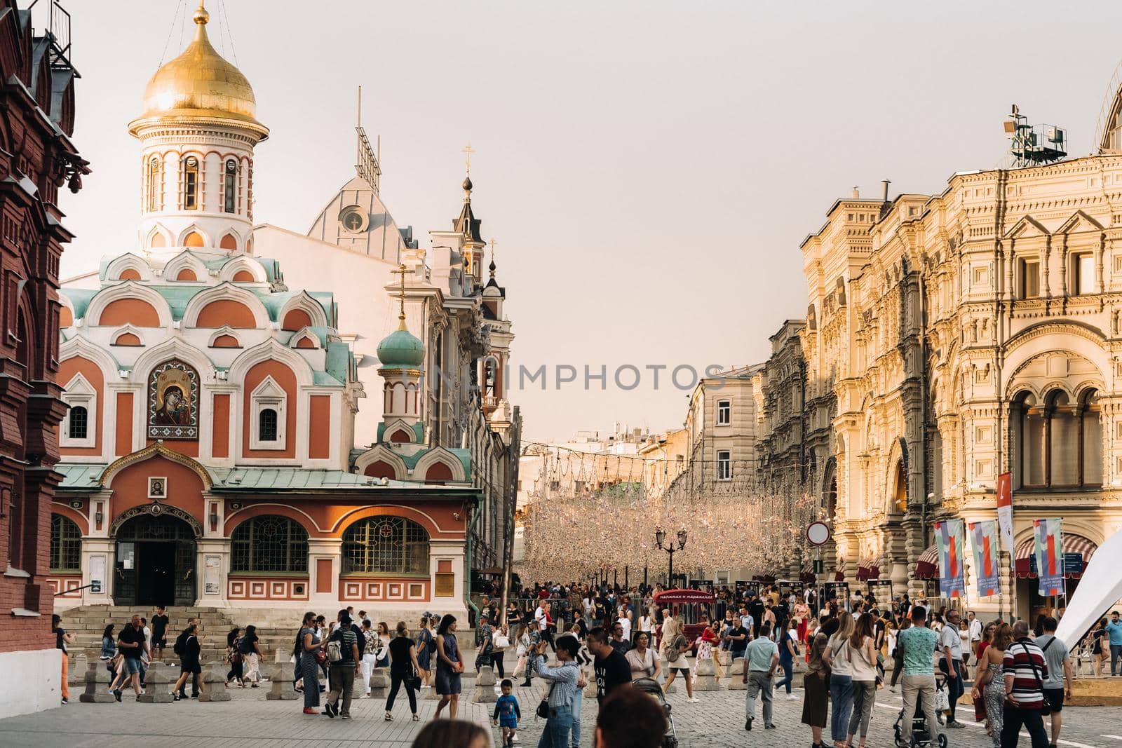 June 6, 2019.Red Square, Moscow, Russia.Kremlin towers and tourists on Red Square at sunset in Moscow by Lobachad