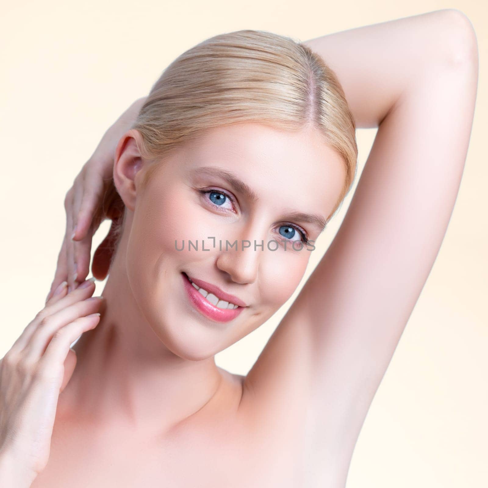 Closeup personable woman showing her clean and smooth skin armpit. by biancoblue