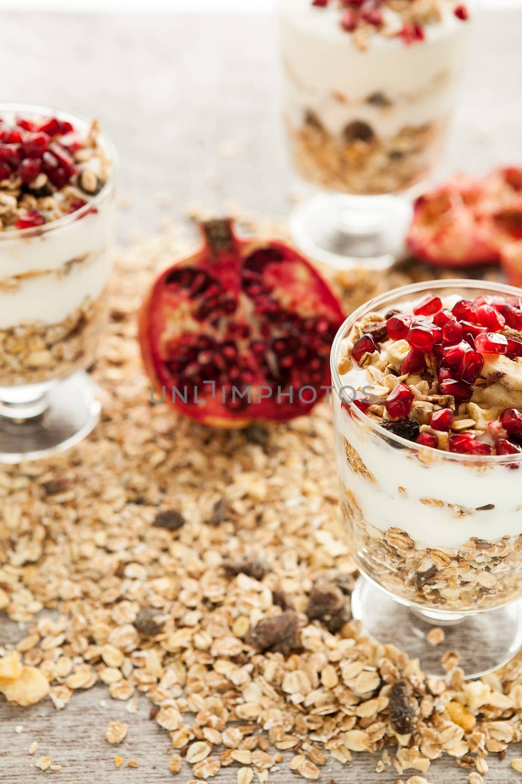 Close up on glasses with home made muesli with pomegranate