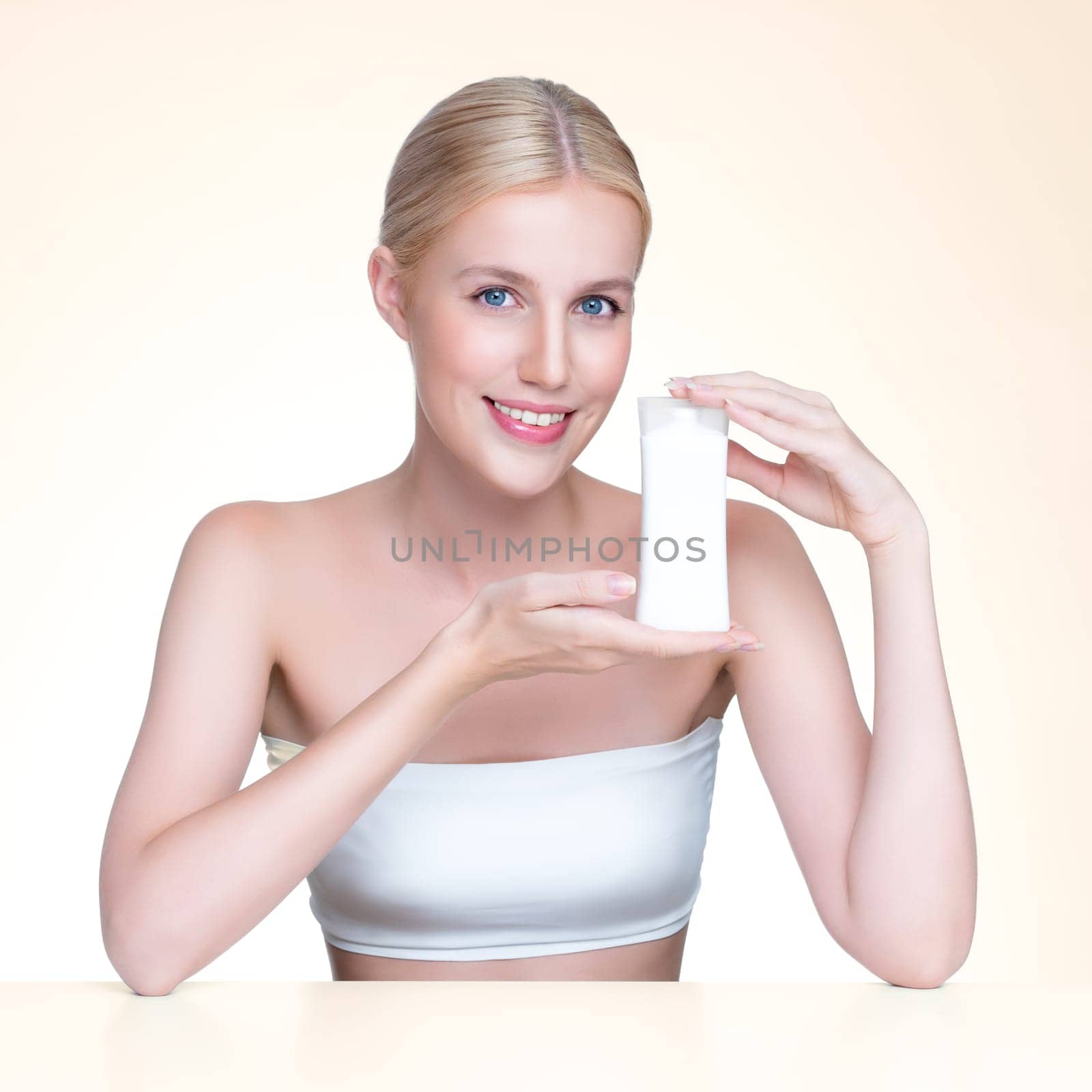 Personable perfect skin woman holding mockup moisturizer product. by biancoblue