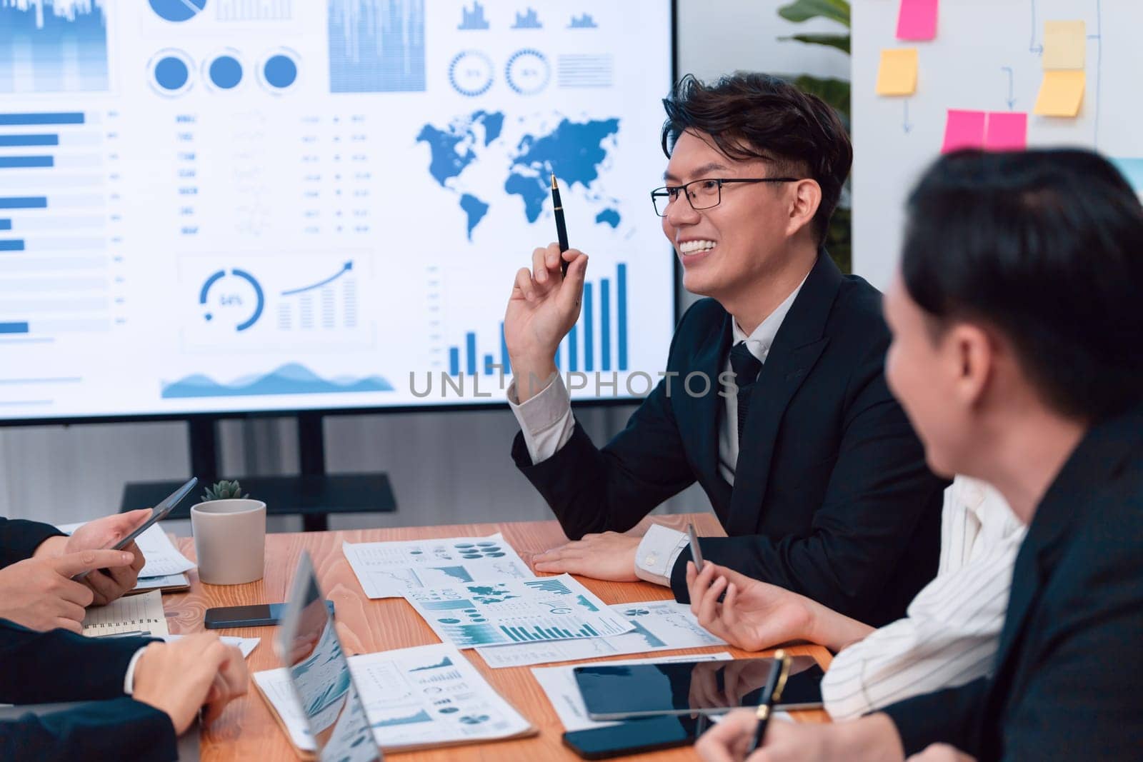 Business team of financial data analysis meeting with business intelligence, report paper and dashboard on laptop for marketing strategy. Business people working together to promote harmony in office.