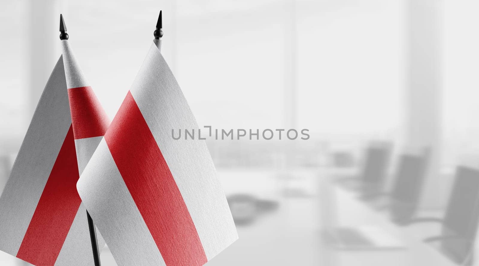 A small Belarus flag on an abstract blurry background by butenkow