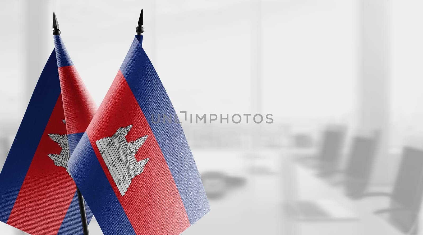 A small Cambodia flag on an abstract blurry background.