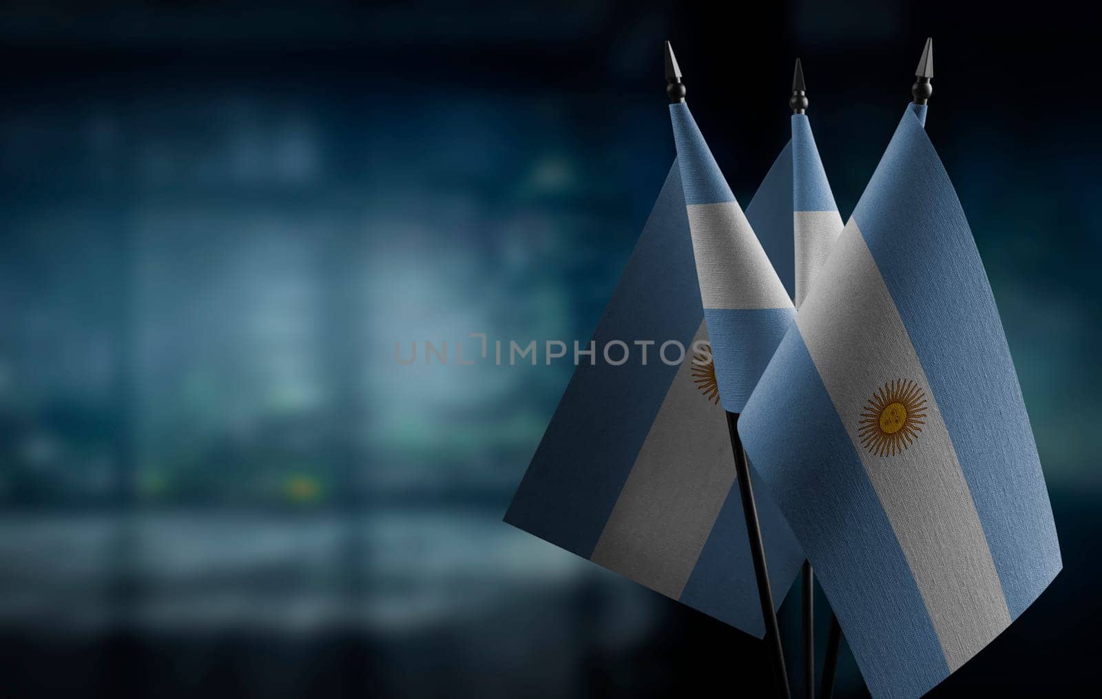 A small Argentina flag on an abstract blurry background.