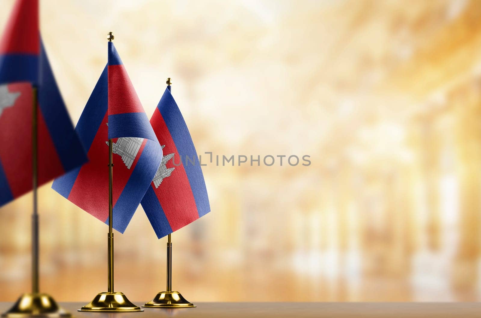 A small Cambodia flag on an abstract blurry background.