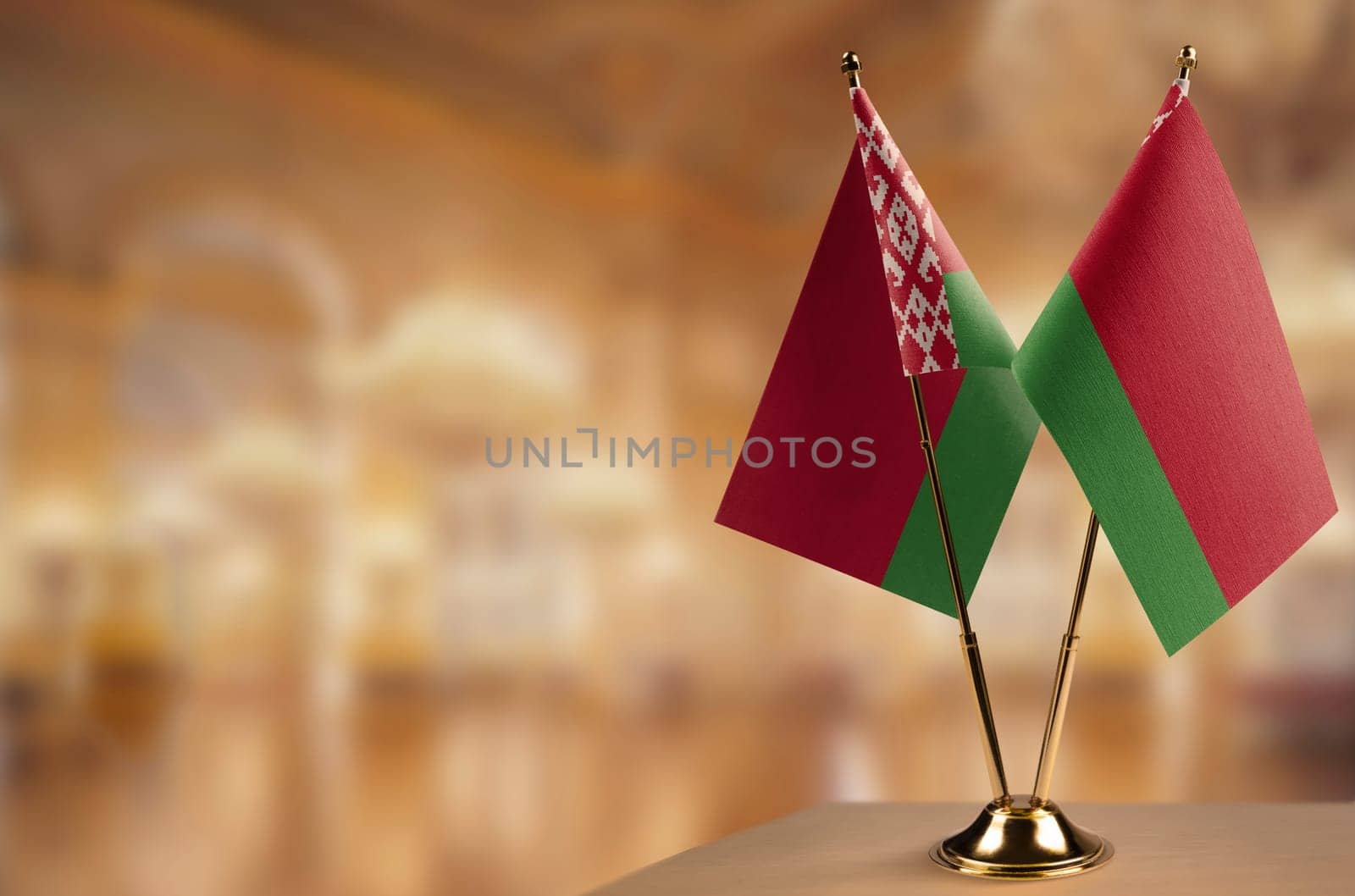 A small Belarus flag on an abstract blurry background.