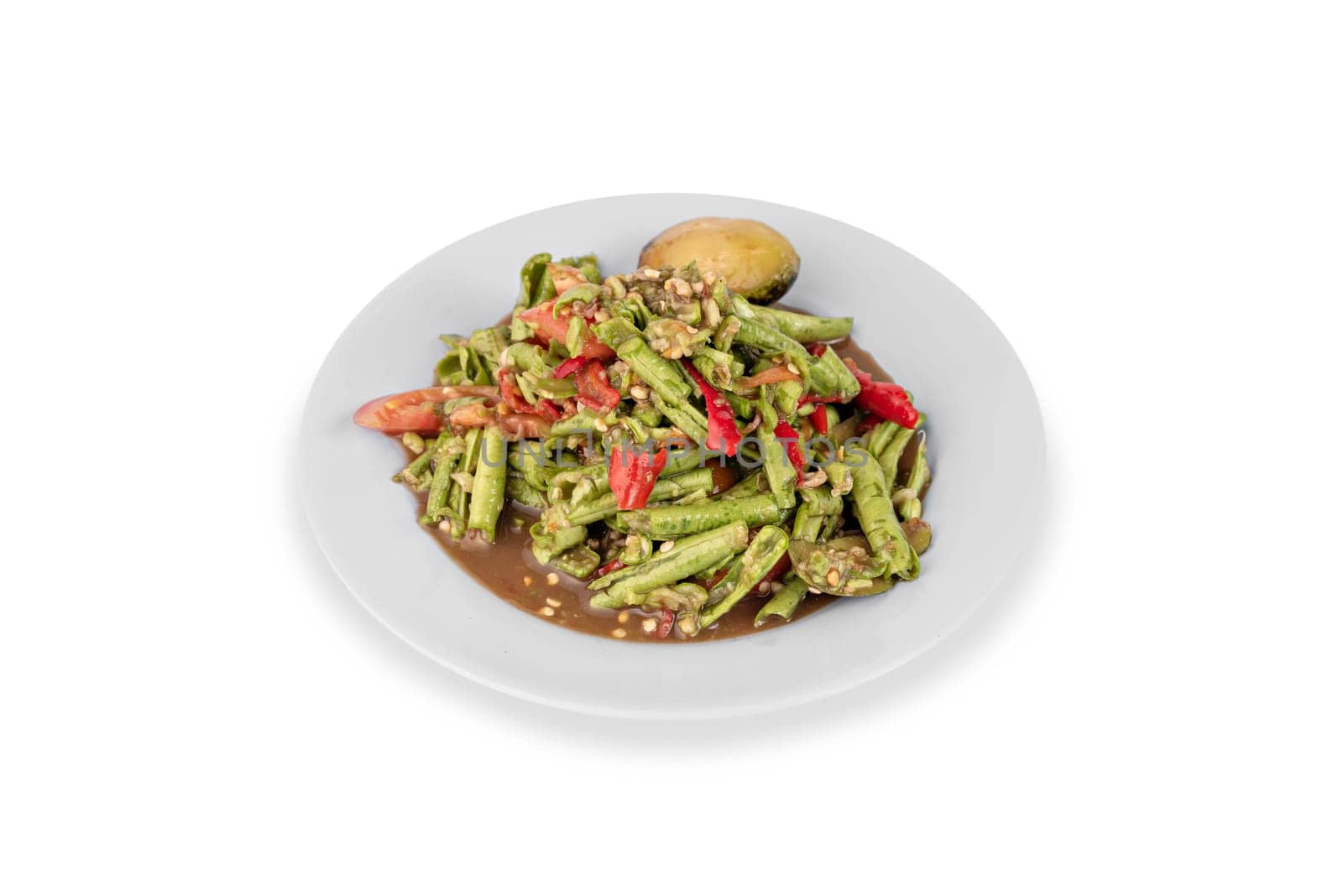 spicy cowpea salad on plate over white background , asian cuisine