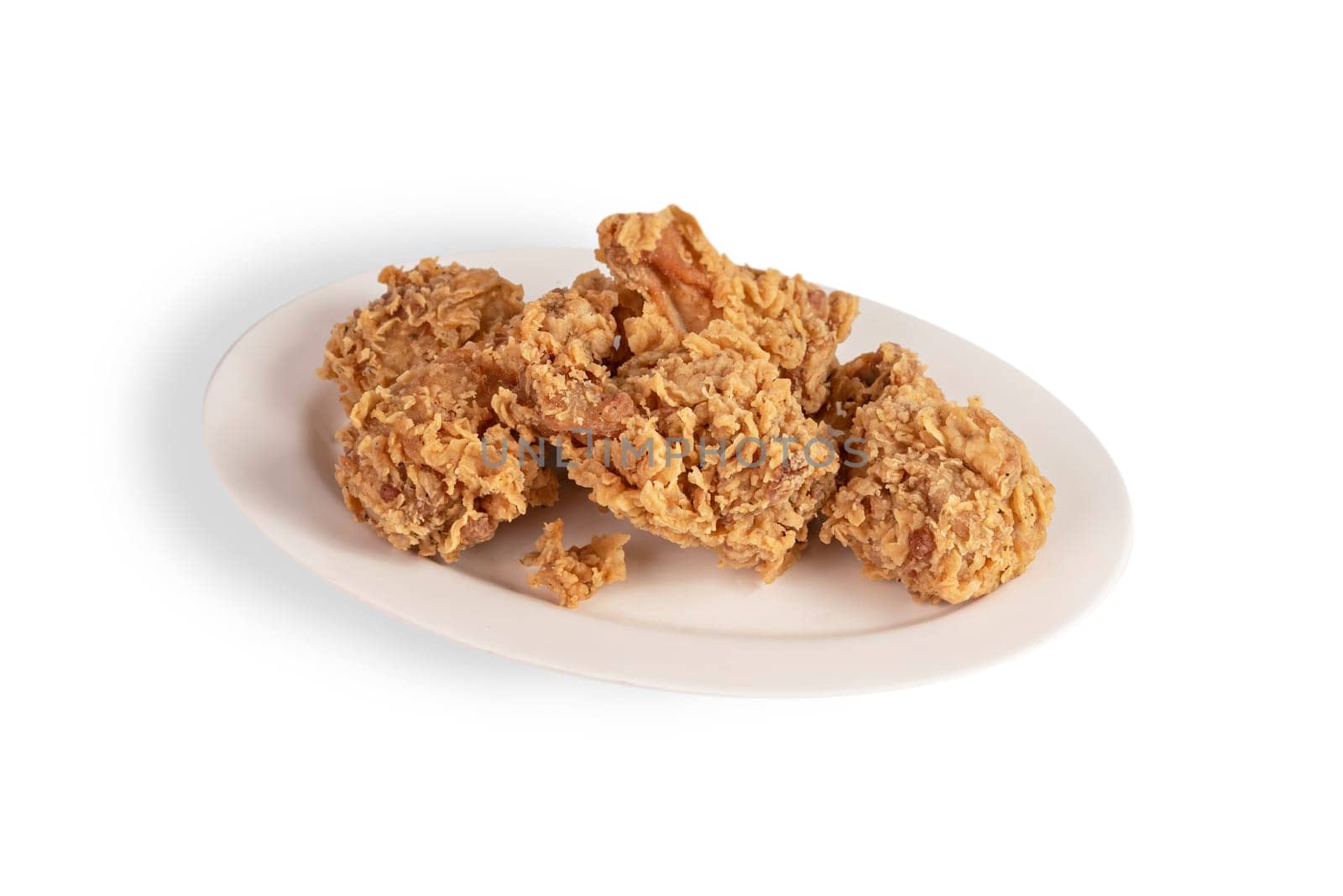 deep fried chicken  on dish over white background