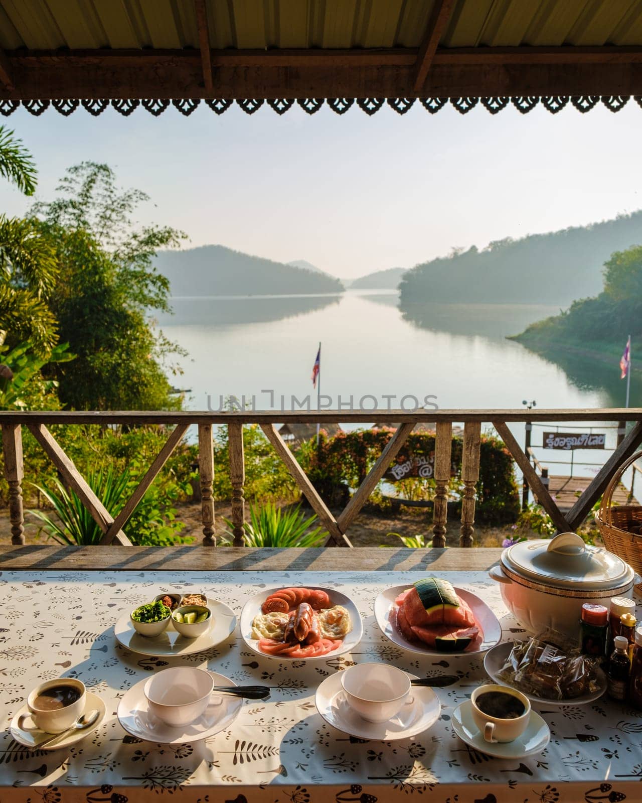 Breakfast from a wooden bungalow with a view at Huai Krathing lake in North Eastern Thailand Isaan.