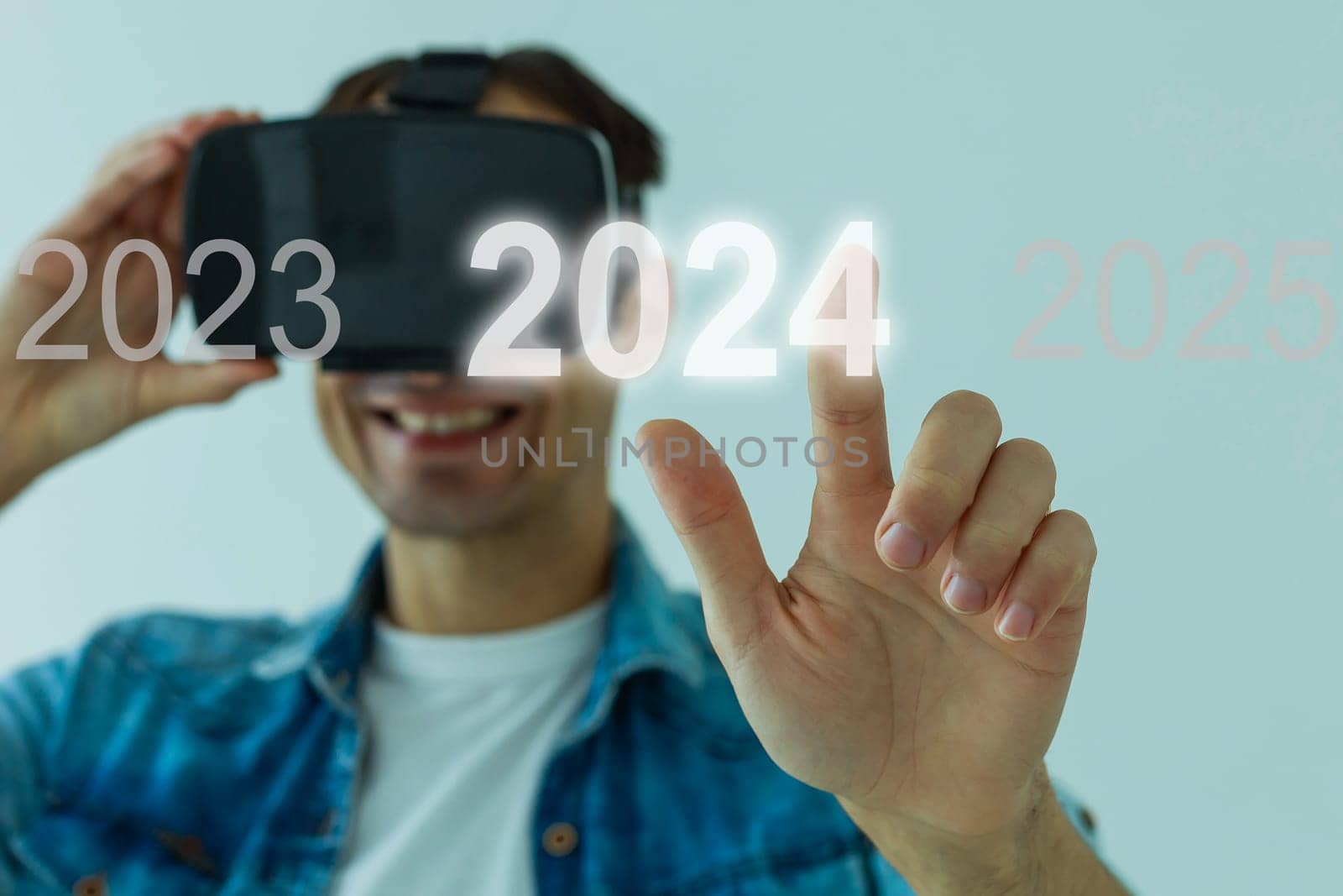 A man touching on virtual screen 2024. Business new year concept, welcome to year 2024 concept. by Andelov13