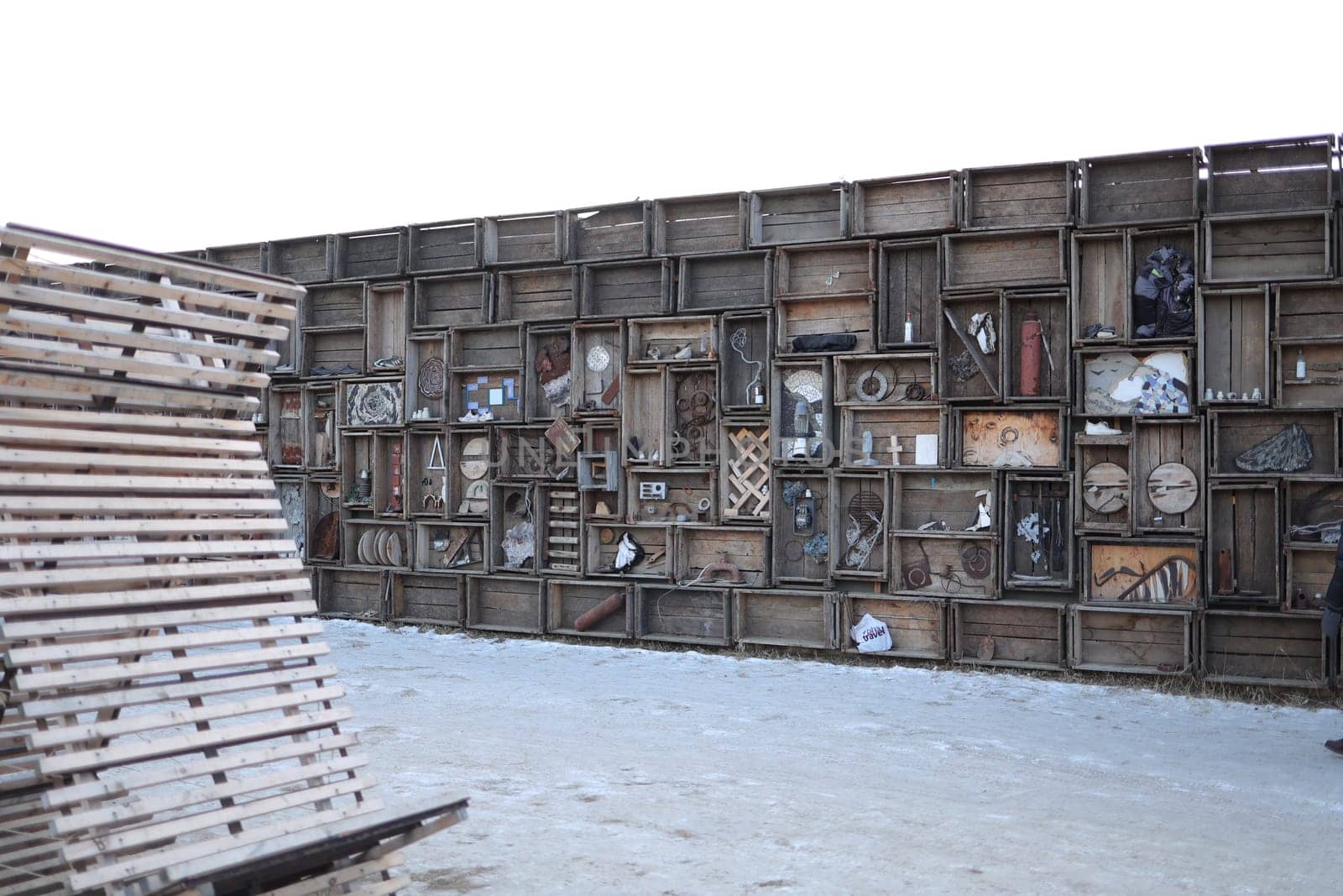 A designer wall made of crates and old things created by young designers on Olkhon Island