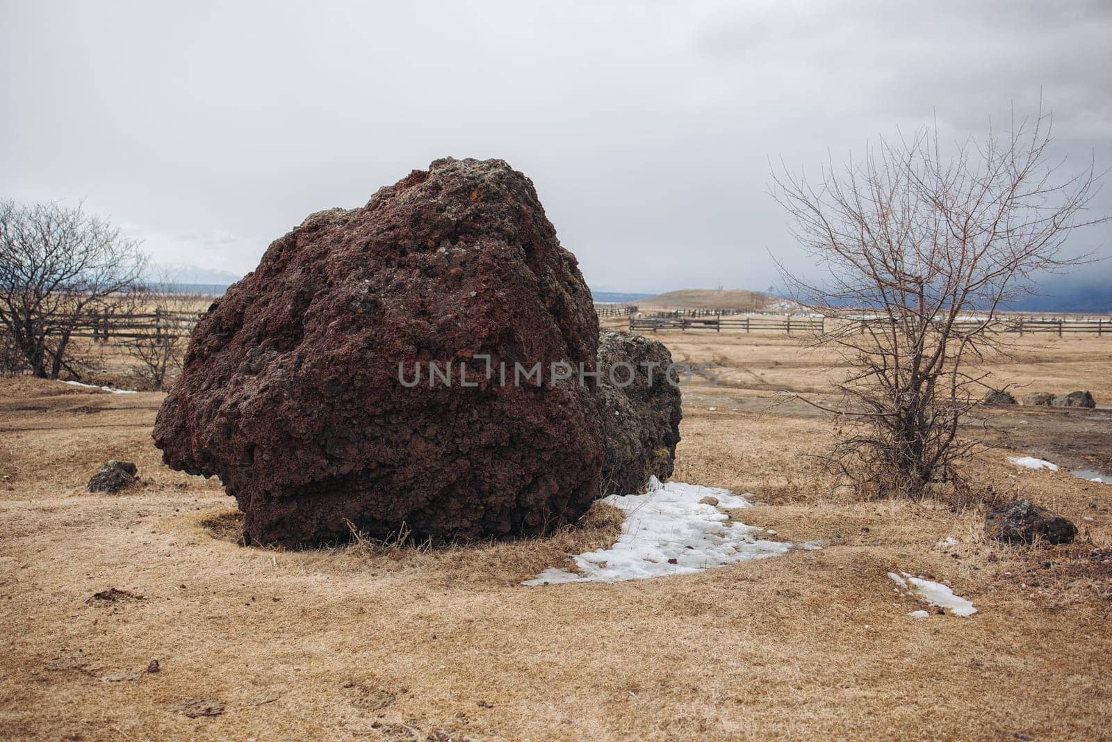 A large volcano penza stone in a deep Buryat village lies motionless waiting for travelers