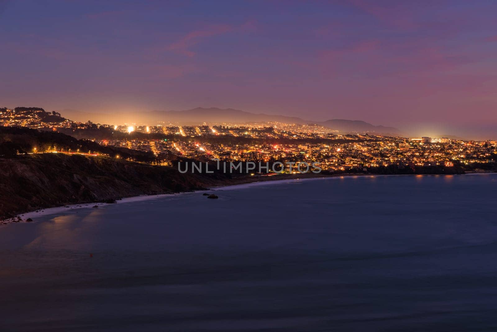 Streets and hills in neighborhoods of San Francisco coast at night by Osaze