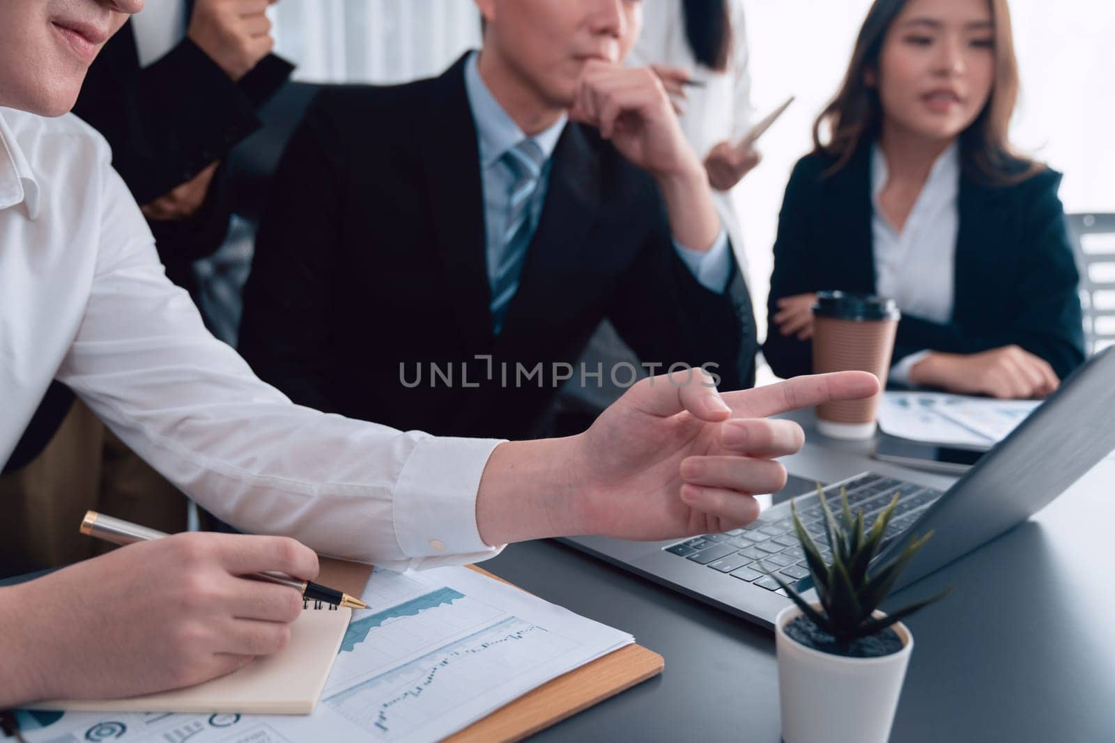 Closeup business team of financial data analysis meeting with business intelligence, report paper and dashboard on laptop for marketing. Business people working together in harmony office.