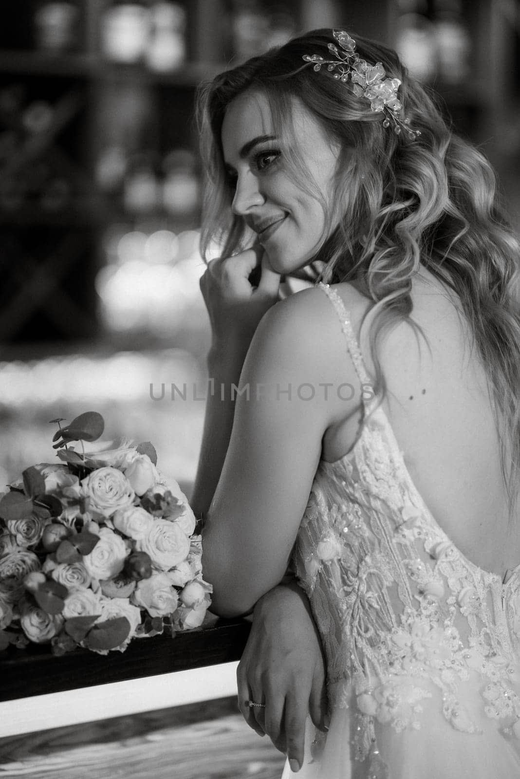 blonde bride in a bar near with a wedding bouquet by Andreua