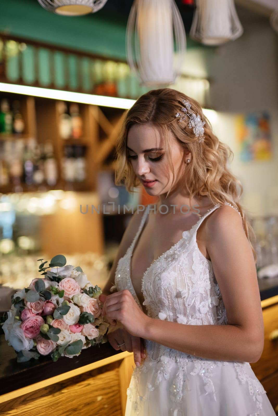 blonde bride in a bar near with a wedding bouquet by Andreua