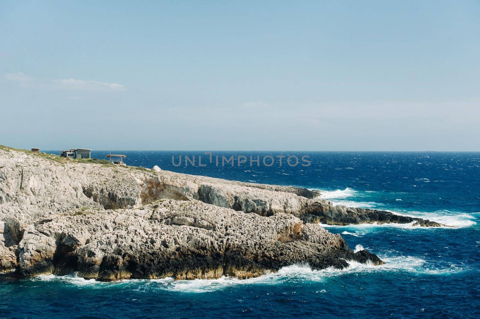 The rocky Porto Limnionas beach on Zakynthos island, Greece.