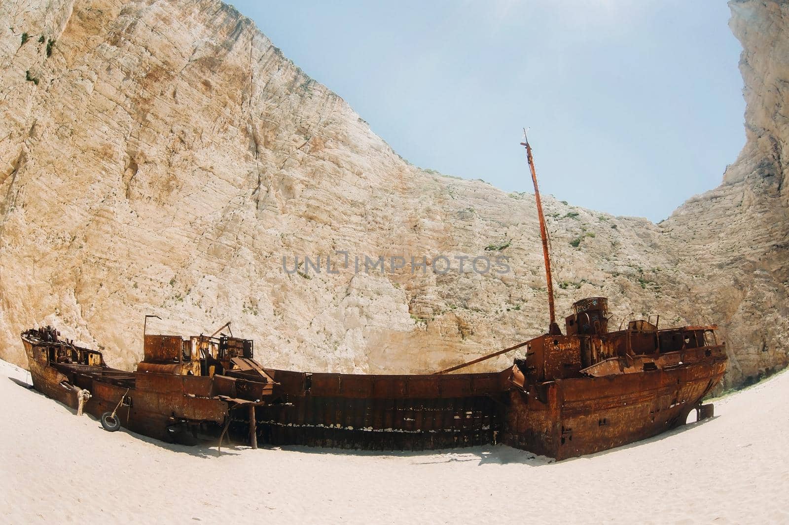 curved ship on Zakynthos island, Greece Navagio beach, or shipwreck beach,sometimes called smugglers ' Bay , on the coast of Zakynthos island, in the Ionian Islands of Greece