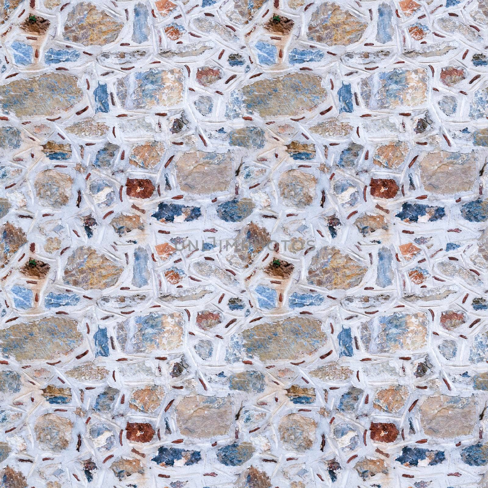 Seamless texture of wall made of multicolored stones. Asymmetric masonry. Four fragments in one.
