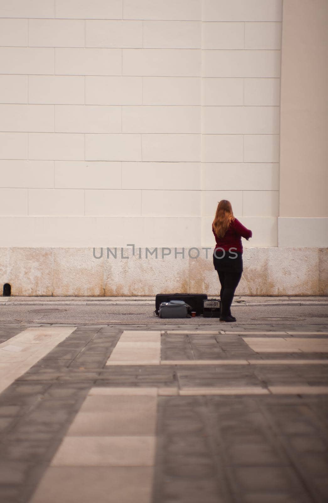 TRIESTE, ITALY - MAY, 14: Female violinist playing in the street on May 14, 2016