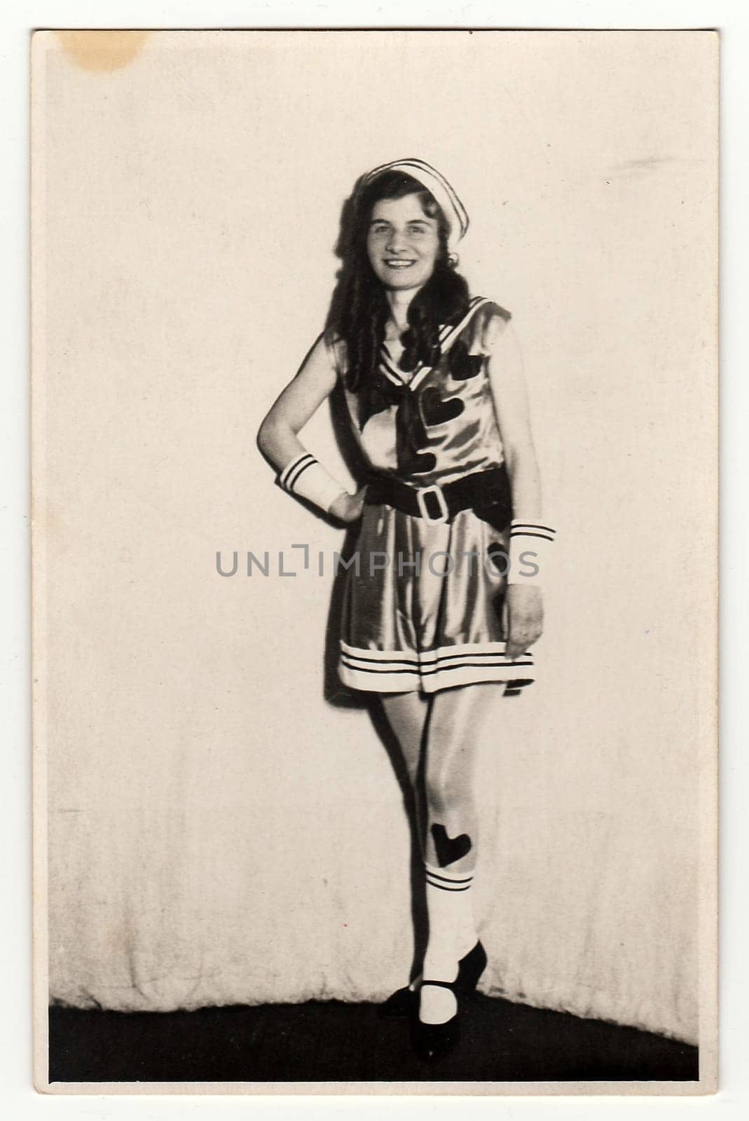 THE CZECHOSLOVAK REPUBLIC, CIRCA 1930s: Vintage portrait photo shows young girl in a retro carnival costum (marine costum). Photo studio portrait, circa 1930s.