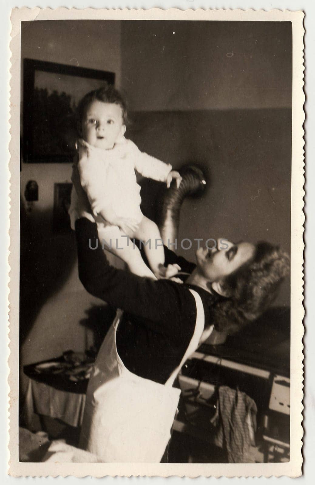 Vintage photo shows a small girl with her mother, circa 1941. by roman_nerud