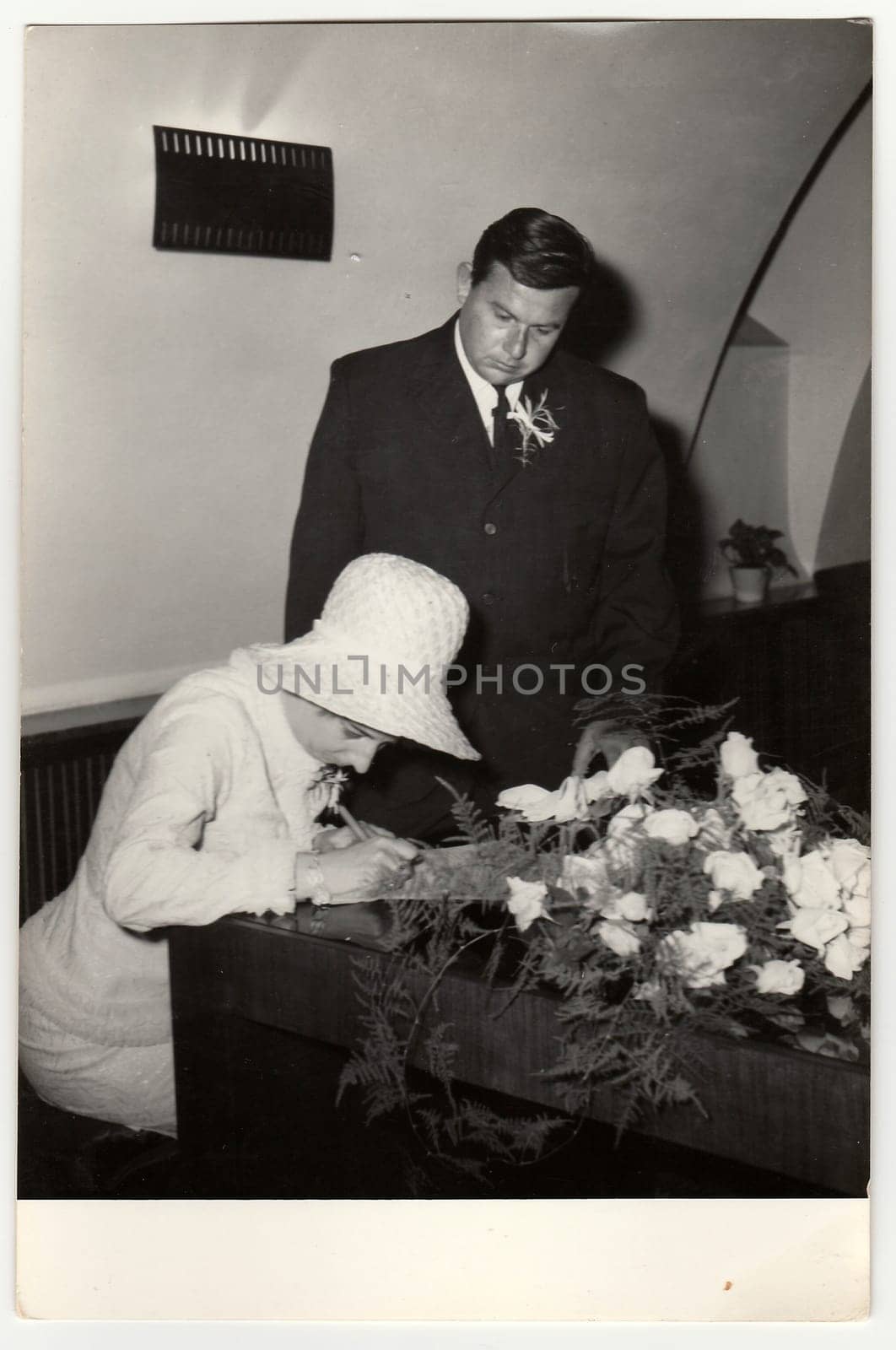 THE CZECHOSLOVAK SOCIALIST REPUBLIC, CIRCA 1970: A vintage photo shows woman to signature wedding documents, circa 1970.