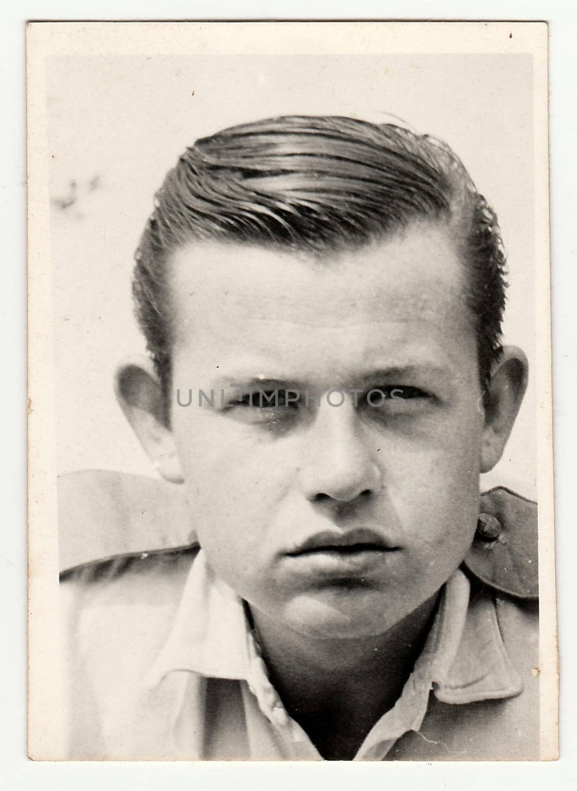 Vintage photo of young man, circa 1960s. by roman_nerud