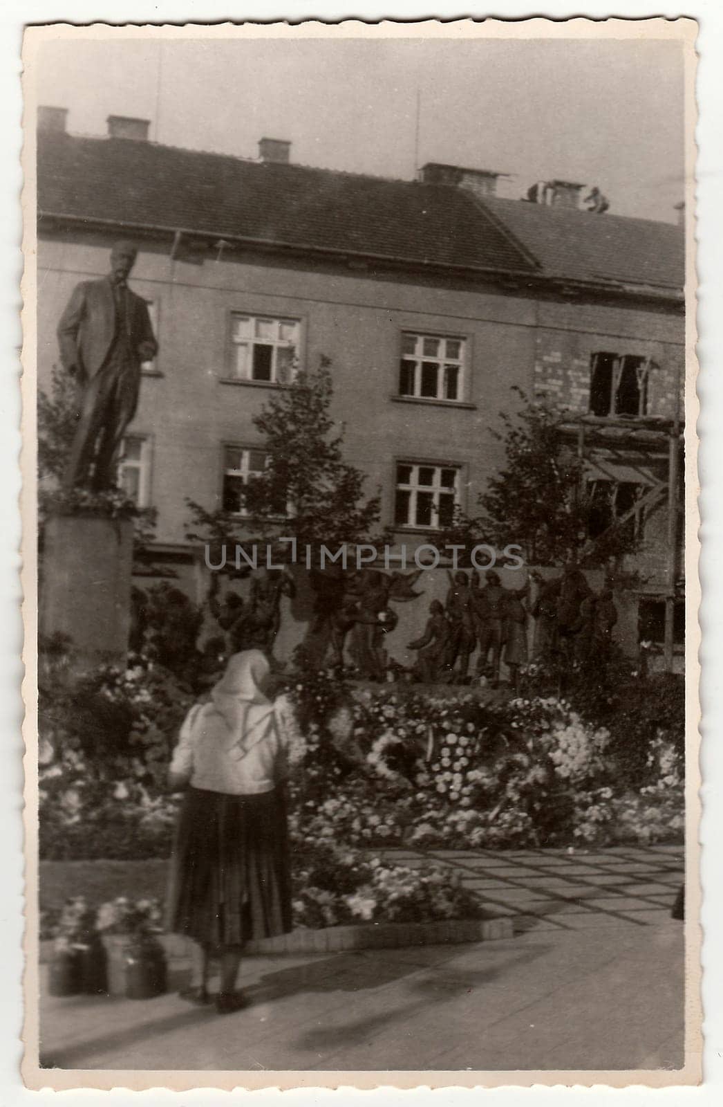 Vintage photo shows rural woman in front of sculpture (Tomas Garrigue Masaryk), circa 1940s. by roman_nerud