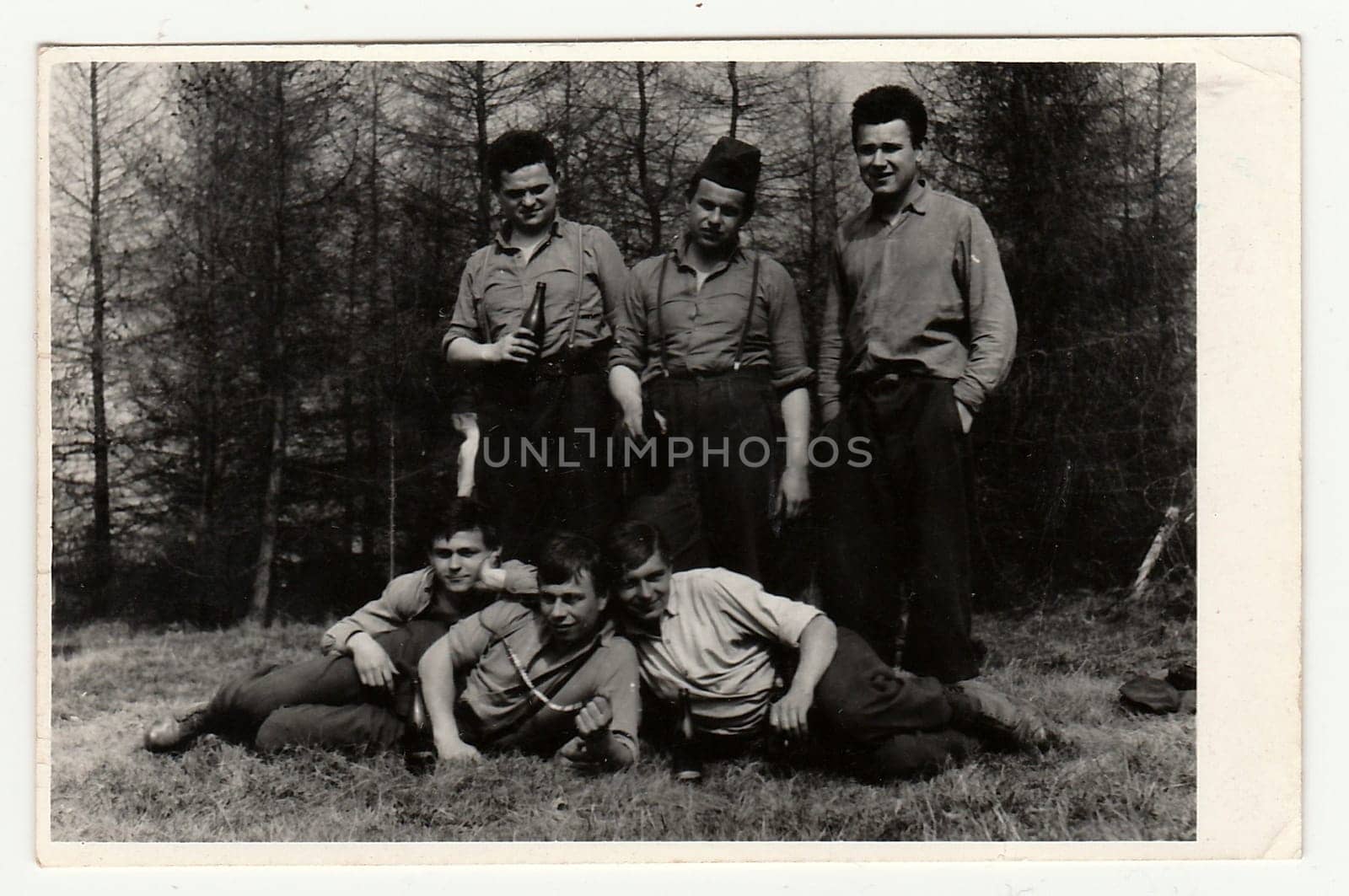 A vintage photo shows soldiers look forward to going out of the Army, circa 1965. by roman_nerud